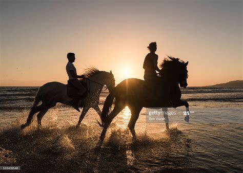People horse riding along the beach. Tarifa, Cadiz, Costa de la Luz ...