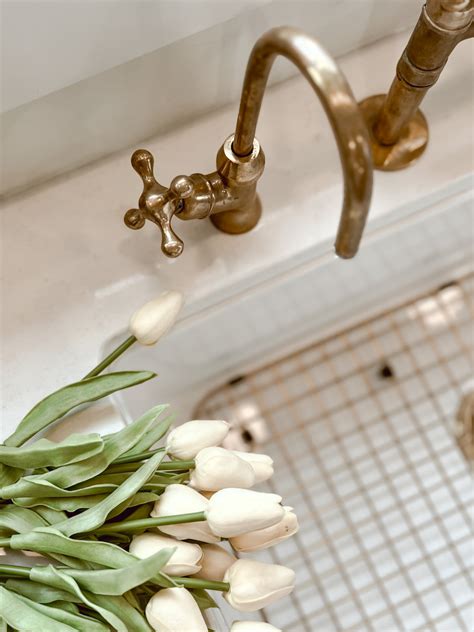 Our Unlacquered Brass Kitchen Faucets - Deb and Danelle