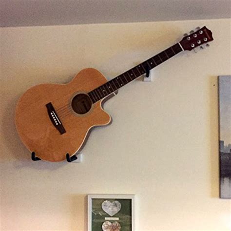 Online forums are debating the best guitar hanger brands today 27