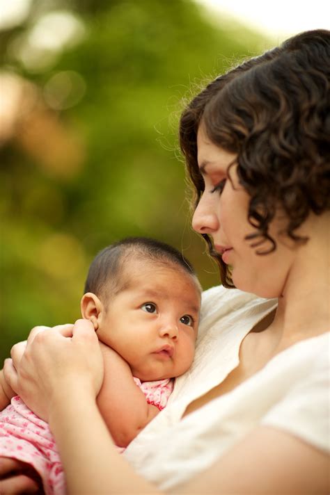 mother holding baby