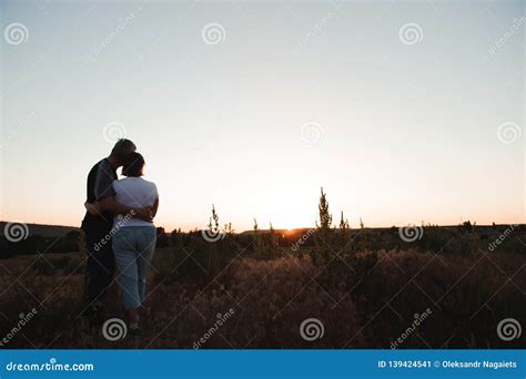 Couple Holding Hands at Sunset Enjoying Romance and Sun Stock Image ...