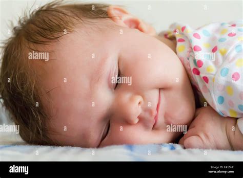 Cute sleeping newborn Stock Photo - Alamy