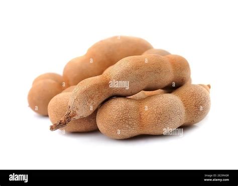 Fresh tamarind pods close up on white backgrounds.Tamarindus fruits ...
