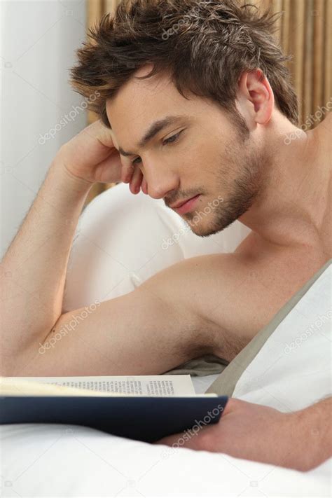 Man reading in bed Stock Photo by ©photography33 9580229