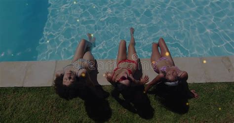 sunbathing trio  friends lounging  backyard pool edge  bikinis