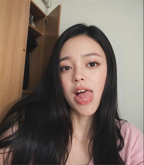 Arafed woman with long black hair sticking out her tongue - SeaArt AI
