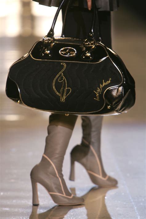 Baby Phat: The Iconic History Of The Curvy Cat