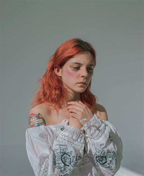 Download Bruised Redhead Girl Wallpaper | Wallpapers.com