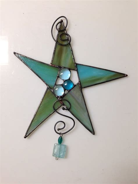 a stained glass star hanging on a wall