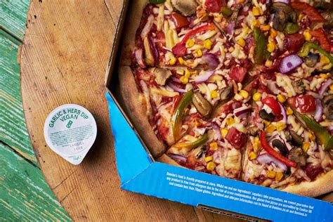 Domino's Officially Adds Two Vegan Pizzas & Vegan Garlic Dip To Their