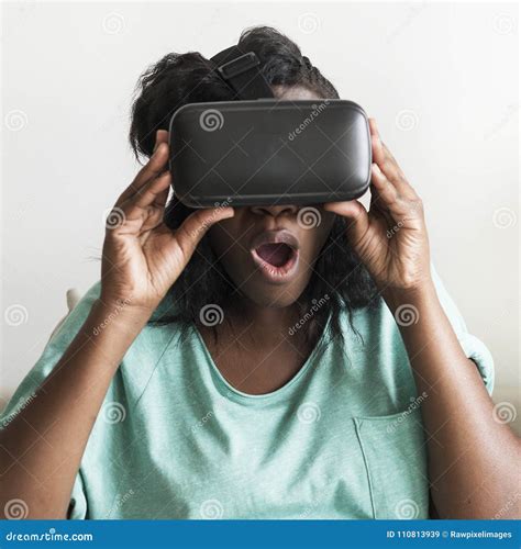 Black Woman Experiencing Virtual Reality with a VR Headset Stock Image