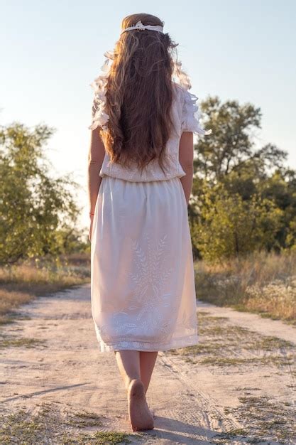 Premium Photo | Close up beautiful barefoot woman in white dress ...