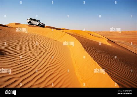 Off-road vehicle in the sand dunes, desert safari, desert Rimal Wahiba ...