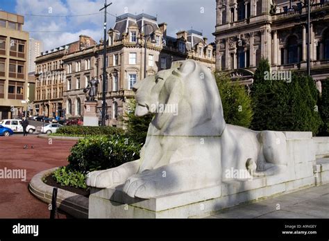 One of the lion statues at the war memorial George Square, Glasgow ...