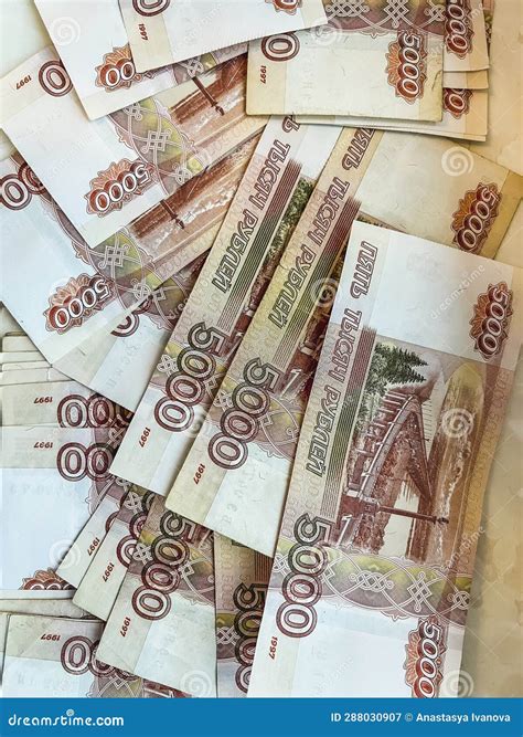 A Lot of Five-thousand-dollar Bills are Scattered on the Table. Stock