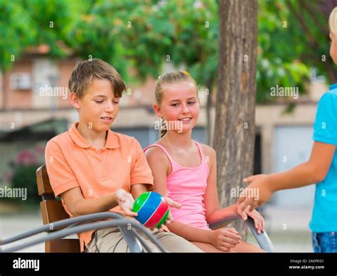 children  playing ball   playground stock photo alamy