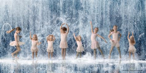 Mounds View MN Kid's Photographer Two Sisters Dancing In The Rain