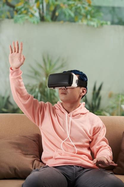 Premium Photo | Young man playing vr game