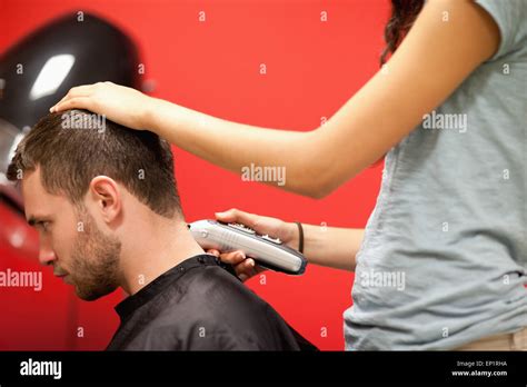 Male student having a haircut Stock Photo - Alamy