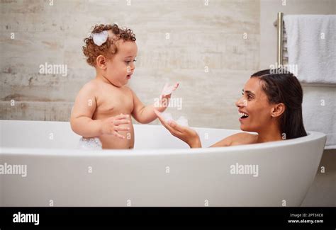 Mother, baby and bath in bathroom home, health and cleaning. Mom ...