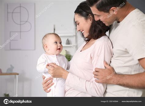 Cute Baby Parents Home — Stock Photo © serezniy #350140944