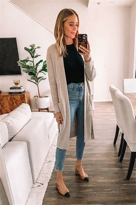 Fashion Jackson Wearing Beige Sweater Black Top Slim Jeans Slingbacks