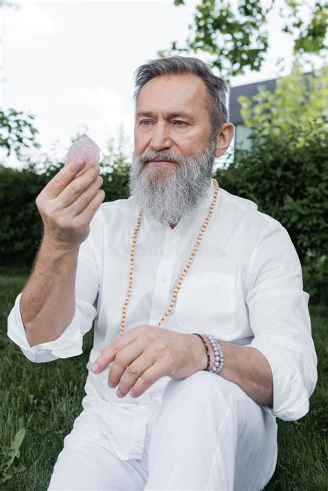 senior master guru  white shirt stock photo image