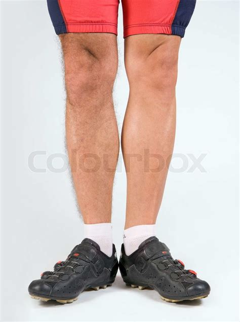 cyklist med et halvt barberede ben | Stock foto | Colourbox