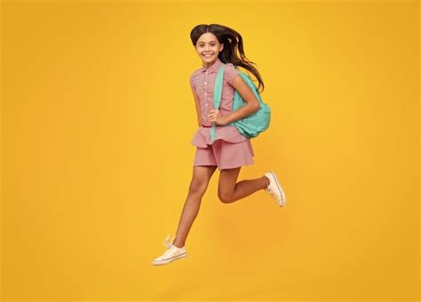 Premium Photo | School girl in school uniform with school bag Crazy run ...