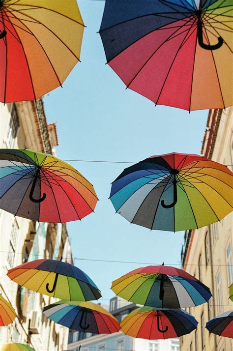 Red yellow and blue umbrella photo – Free Umbrella Image on Unsplash