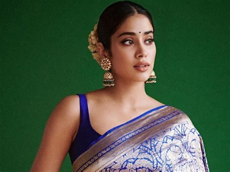 janhvi kapoor emanates glam  navy blue raw mango saree