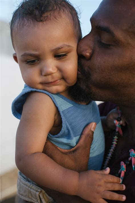 "Young Dad Enjoying Son Outside On Sunny Day" by Stocksy Contributor