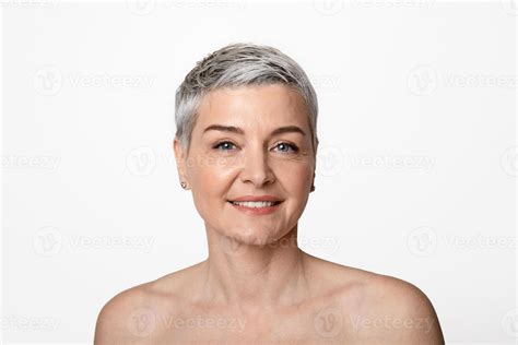 Beauty Portrait Of Smiling Nude Middle Aged Woman With Short Haircut