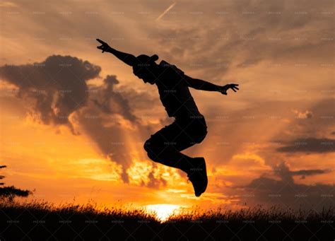 Man Jumping At Sunset - Stock Photos | Motion Array