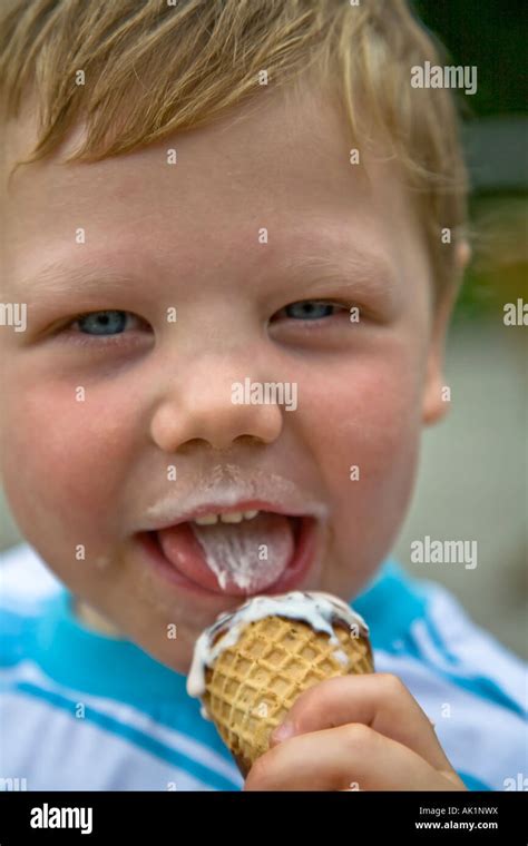 Boy eating ice cream cone child close up cone consuming hi-res stock ...