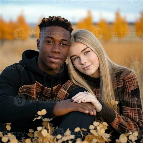 Loving teenage interracial couple is enjoying a romantic autumn day AI