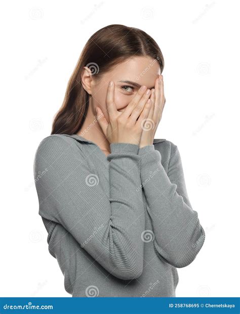 Embarrassed Young Woman Covering Face with Hands on White Background