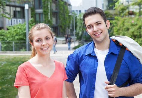 Two Students Talking on Campus Stock Image - Image of class, couple ...