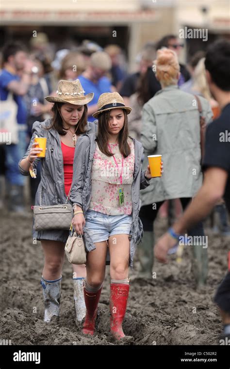 Two girls in the mud at the Glastonbury Festival 2011 Stock Photo ...