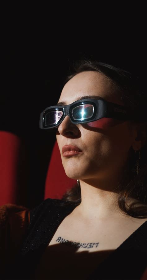 Woman Wearing 3D Glasses while Eating Popcorn · Free Stock Video